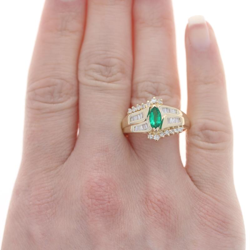 Size: 10 1/2
Sizing Fee: Up 2 sizes for $35 or Down 2 sizes for $35

Metal Content: 14k Yellow Gold

Stone Information
Synthetic Emerald
Carat(s): .60ct
Cut: Marquise
Color: Green

Natural Diamonds
Carat(s): .40ctw
Cut: Baguette & Round