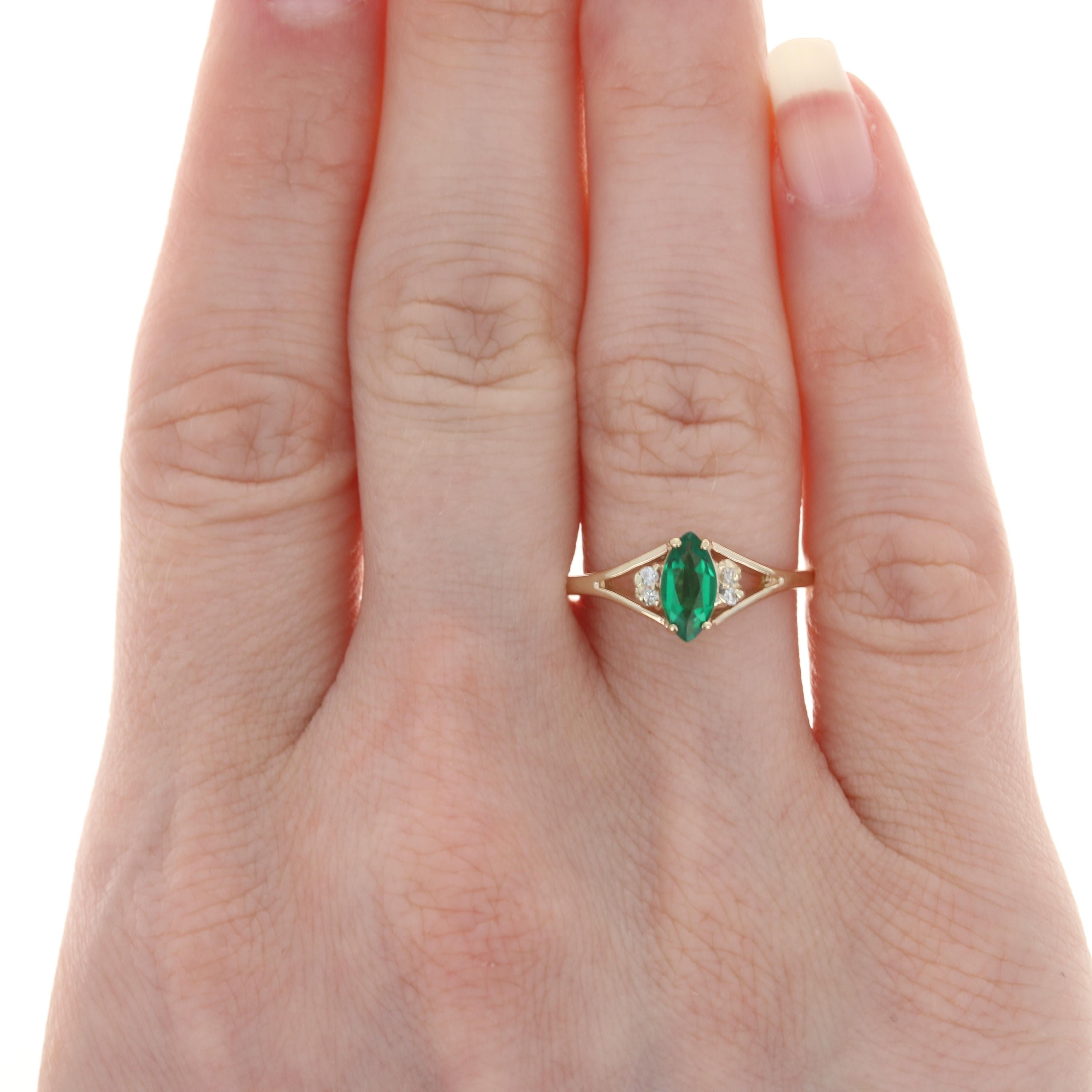 Size: 7 1/2
 Sizing Fee: Up 2 sizes for $25 or down 3 sizes for $20
 
 Metal Content: 14k Yellow Gold 
 
 Stone Information: 
 Synthetic Emerald
 Carat: .60ct
 Cut: Marquise
 Color: Green 
 Size: 8mm x 4mm
 
 Natural Diamonds
 Carats: .04ctw
 Cut: