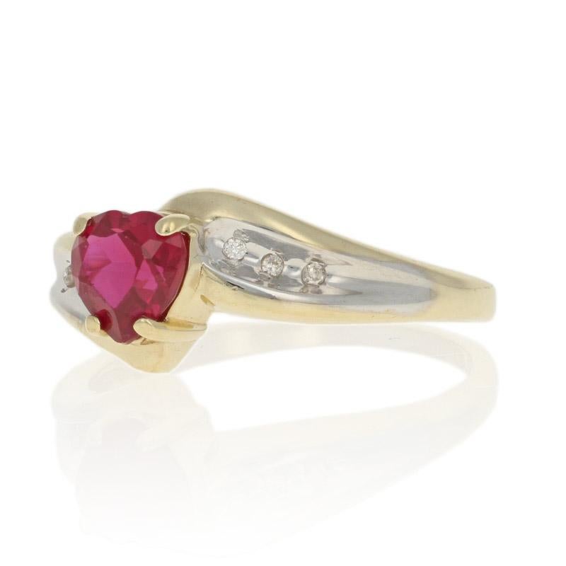 Size:  7 1/4
Sizing Fee: Up 2 sizes for $25 or Down 2 sizes for $20 

Metal Content: 10k Yellow Gold & 10k White Gold 

Stone Information: 
Synthetic Ruby
Color: Red
Cut: Heart
Carat(s): 1.00ct

Natural Diamonds  
Clarity: I1
Color: I - J
Cut: