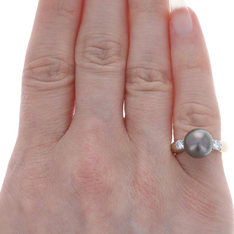 Yellow Gold Tahitian Pearl & Diamond Ring 14k .24ctw

Stone Information:
Tahitian Pearl

Natural Diamonds
Carat(s): .24ctw
Cut: Round Brilliant
Color: F - G
Clarity: VS1 - VS2
Total Carats: .24ctw

Additional Information
Material: Metal 14k Yellow