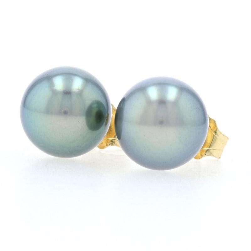 Step out in style wearing this fabulous pair of pearl earrings! Composed of glowing 18k yellow gold and fashioned in a sophisticated stud style, these new earrings showcase genuine Tahitian pearls which have a greenish hue with slight brown tones