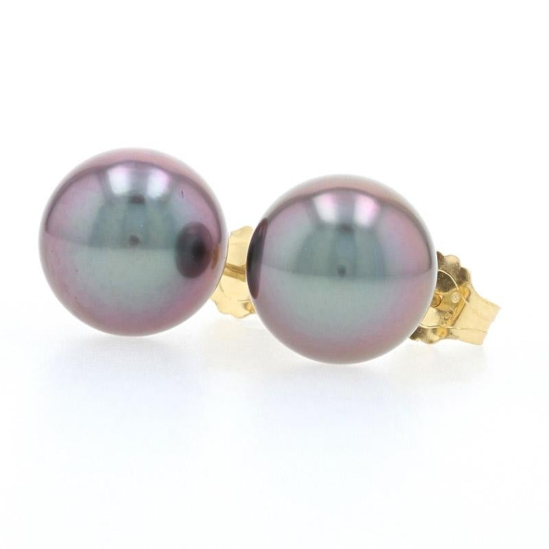 Endless style possibilities await you with this chic pair of pearl earrings! Composed of glowing 18k yellow gold and fashioned in a sophisticated stud style, these new earrings showcase genuine Tahitian pearls which have a slate tone that is just