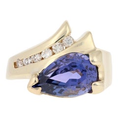 Yellow Gold Tanzanite and Diamond Ring, 14 Karat Pear 3.11 Carat Bypass