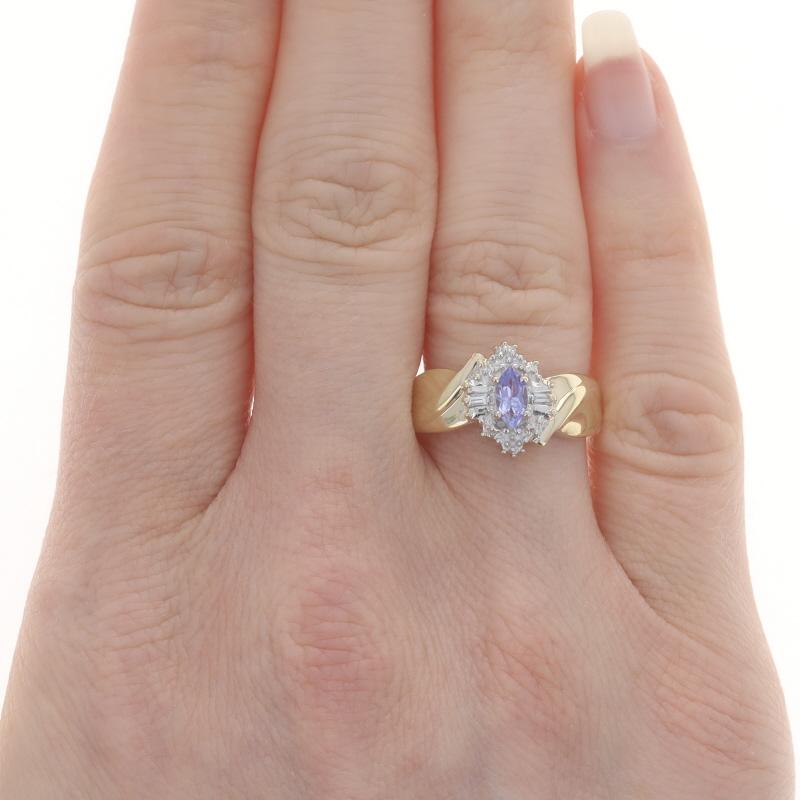 Size: 7
Sizing Fee: Up 2 sizes for $30 or Down 1 size for $20

Metal Content: 10k Yellow Gold & 10k White Gold

Stone Information

Natural Tanzanite
Treatment: Routinely Enhanced
Carat(s): .20ct
Cut: Marquise
Color: Purple

Natural