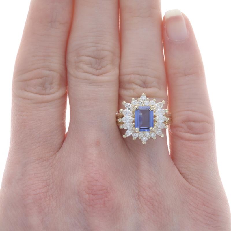 Size: 6
Sizing Fee: Up 1 1/2 sizes for $50 or Down 1 1/2 sizes for $40

Metal Content: 14k Yellow Gold

Stone Information

Natural Tanzanite
Treatment: Routinely Enhanced
Carat(s): 1.83ct
Cut: Emerald
Color: Bluish Purple

Natural Diamonds
Carat(s):