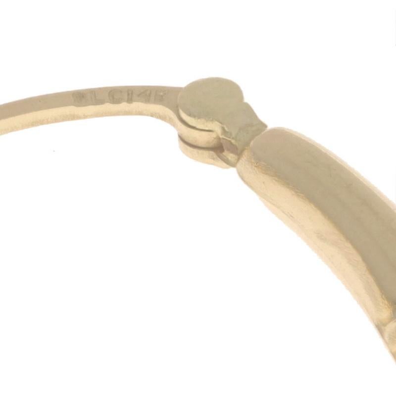 Boucles d'oreilles ovales en or jaune 14k, torsadées et percées en vente 1