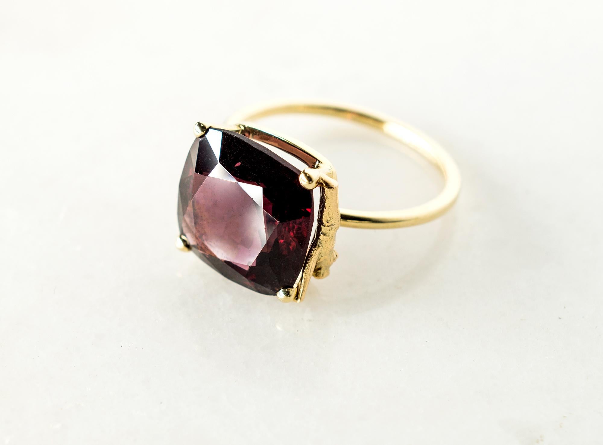 This contemporary ring is in 14 karat yellow gold with red unheated certified natural cushion spinel from Burma, 5.38 carats. It belongs to Tea collection, which was featured in Vogue UA. The size of the ring is 5.5 US (16).

The ring is easy to
