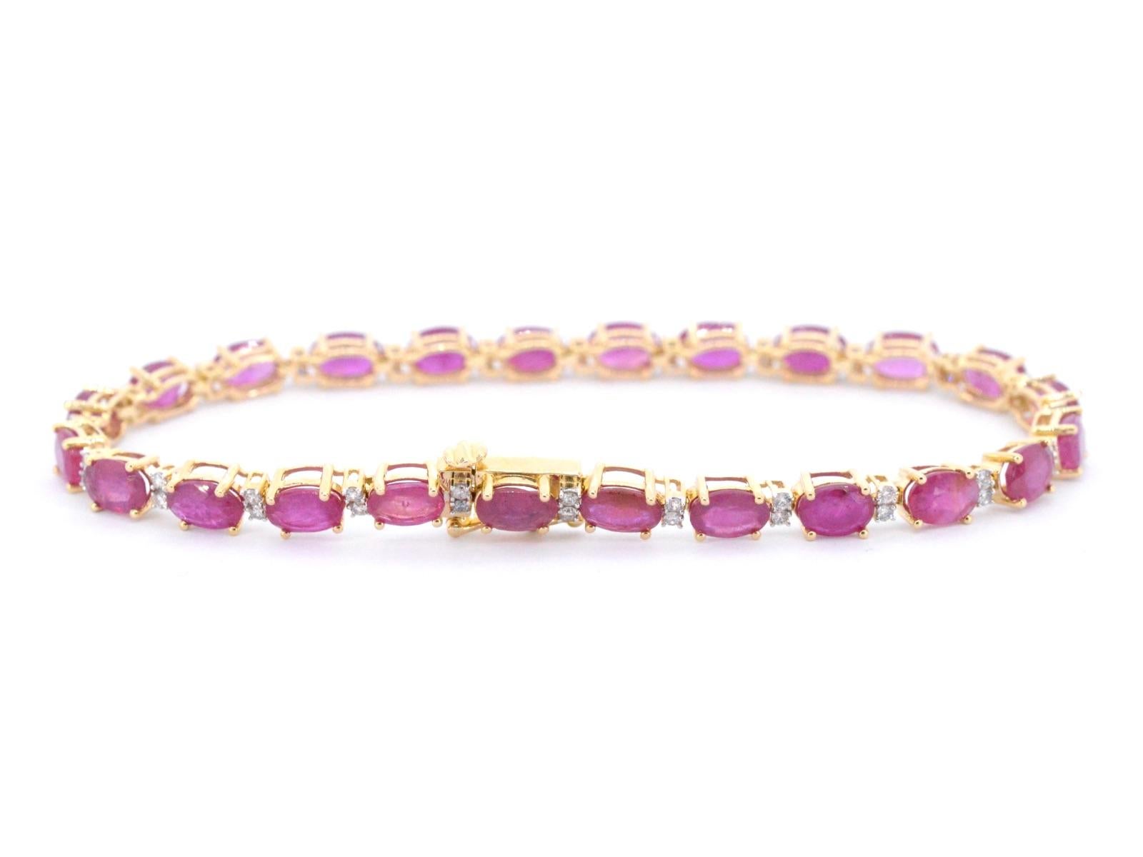 Introducing our stunning yellow gold tennis bracelet, adorned with diamonds and a beautiful ruby gemstone. Crafted with care and precision, this piece boasts a weight of 10 grams and a hallmark of 14 karat 585. The bracelet is 18cm in length, making