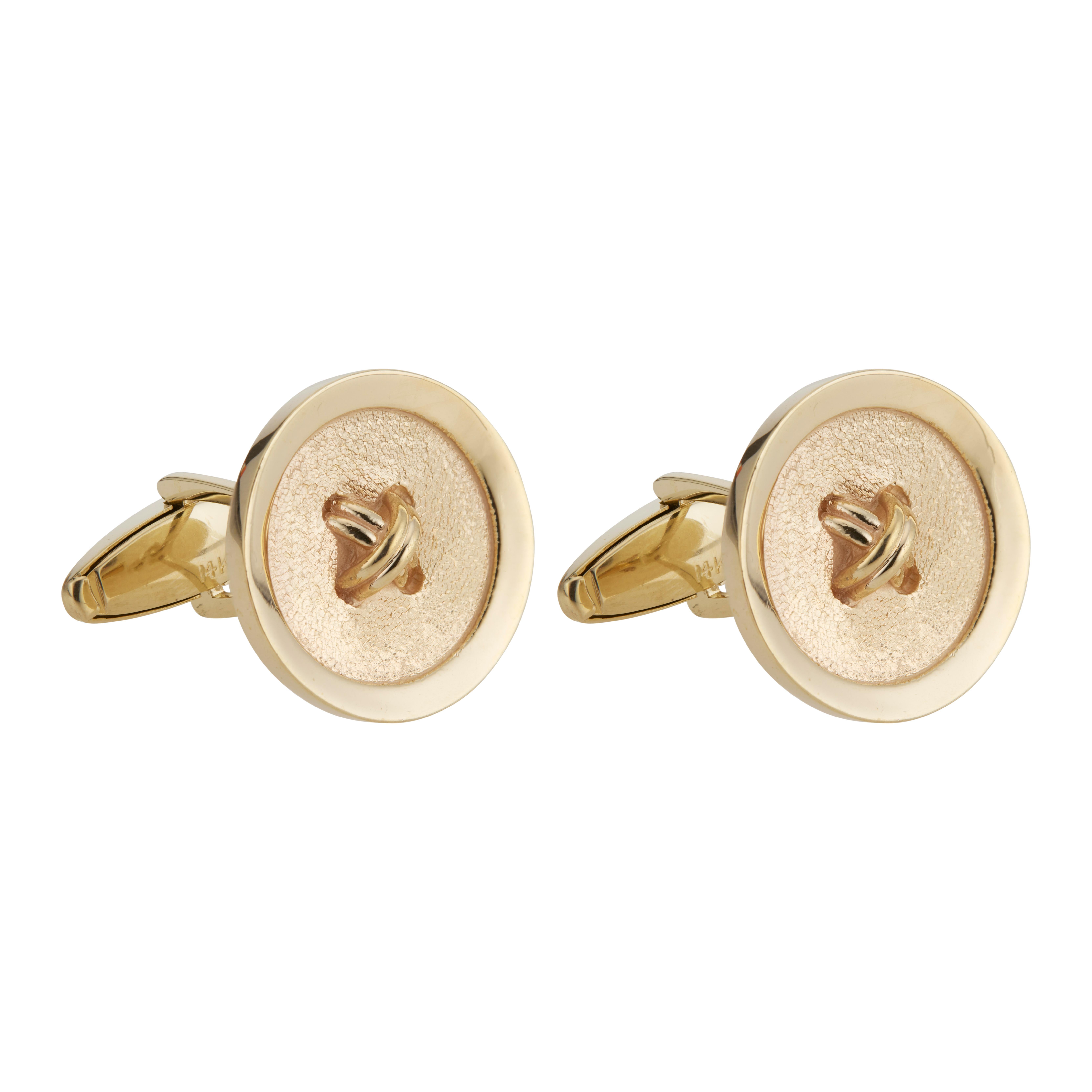 Textured button style 14k yellow gold men's cufflinks. circa 1970

14k yellow gold 
Stamped: 14k
16.7 grams
Top to bottom: 20.3mm or .75 Inch
Width: 20.3mm or .75 Inch
Depth or thickness: 2.6mm
