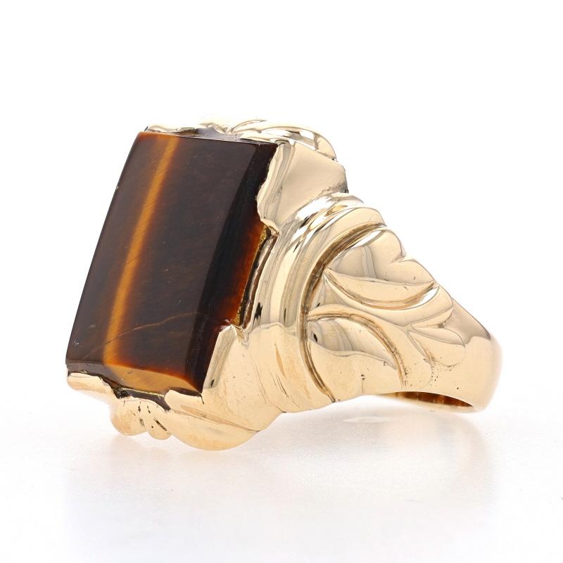 Size: 10 1/2
Sizing Fee: Up 1 size for $40

Era: Vintage

Metal Content: 10k Yellow Gold

Stone Information

Natural Tiger's Eye
Color: Brown

Style: Solitaire

Measurements

Face Height (north to south): 27/32