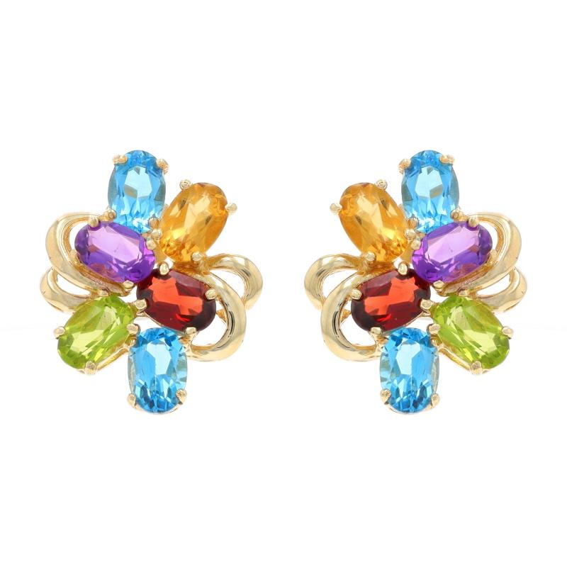 Metal Content: 10k Yellow Gold

Stone Information
Natural Topaz
Treatment: Routinely Enhanced
Carat(s): 2.28ctw
Cut: Oval
Color: Blue

Natural Garnets
Carat(s): 1.10ctw
Cut: Oval
Color: Red

Natural Peridot
Carat(s): 1.00ctw
Cut: Oval
Color: