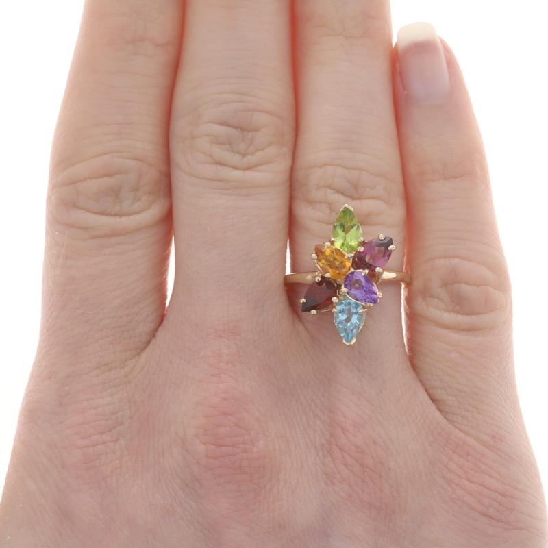 Size: 6
Sizing Fee: Up 2 sizes for $35 or Down 2 sizes for $30

Metal Content: 14k Yellow Gold

Stone Information

Natural Blue Topaz
Treatment: Routinely Enhanced
Carat(s): .50ct
Cut: Pear

Natural Peridot
Carat(s): .45ct
Cut: Pear
Color: