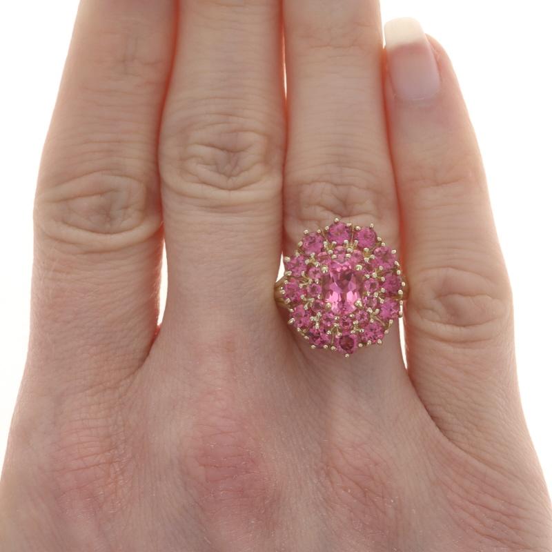 Size: 7 1/4
Sizing Fee: Up 2 sizes for $35 or Down 2 sizes for $35

Metal Content: 14k Yellow Gold

Stone Information

Natural Tourmalines
Carat(s): 3.20ctw
Cut: Oval & Round
Color: Pink

Total Carats: 3.20ctw

Style: Cluster Cocktail Double Halo