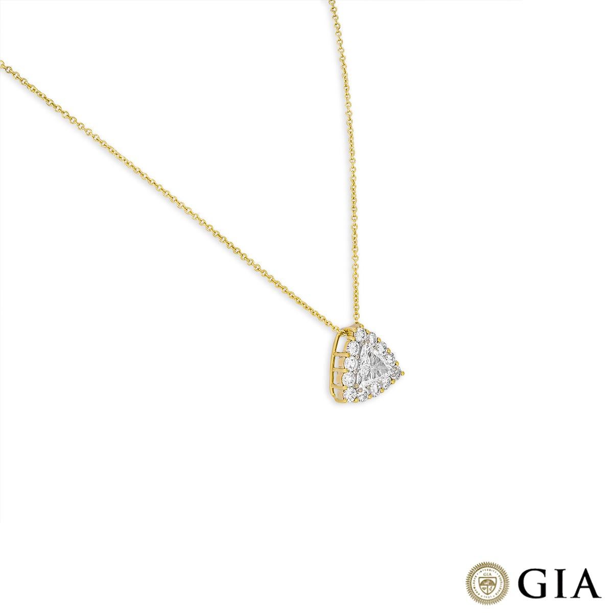A dazzling 18k yellow gold diamond halo pendant. The pendant is set the the centre with a trillion cut diamond weighing 1.00ct, F colour and SI2 clarity. Complementing the centre stone are 12 round brilliant cut diamonds set in a halo with an