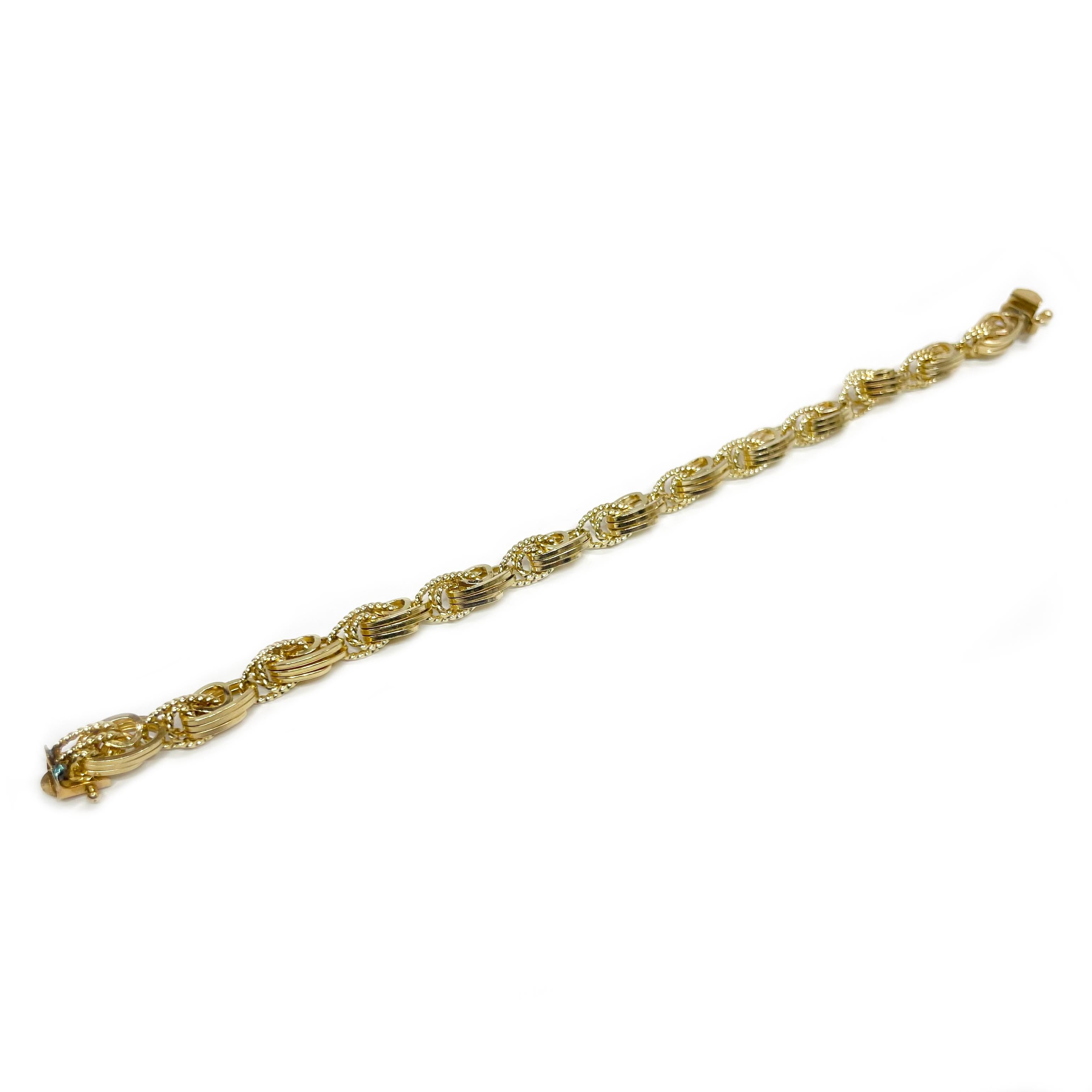 14 Karat Yellow Gold Triple Link Bracelet. The bracelet features yellow gold triple links in both textured and smooth finishes. The bracelet is 0.25