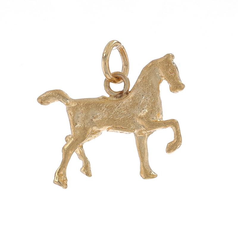 Metal Content: 14k Yellow Gold

Theme: Trotting Horse, Equestrian
Features: Textured Detailing

Measurements
Tall: 5/8