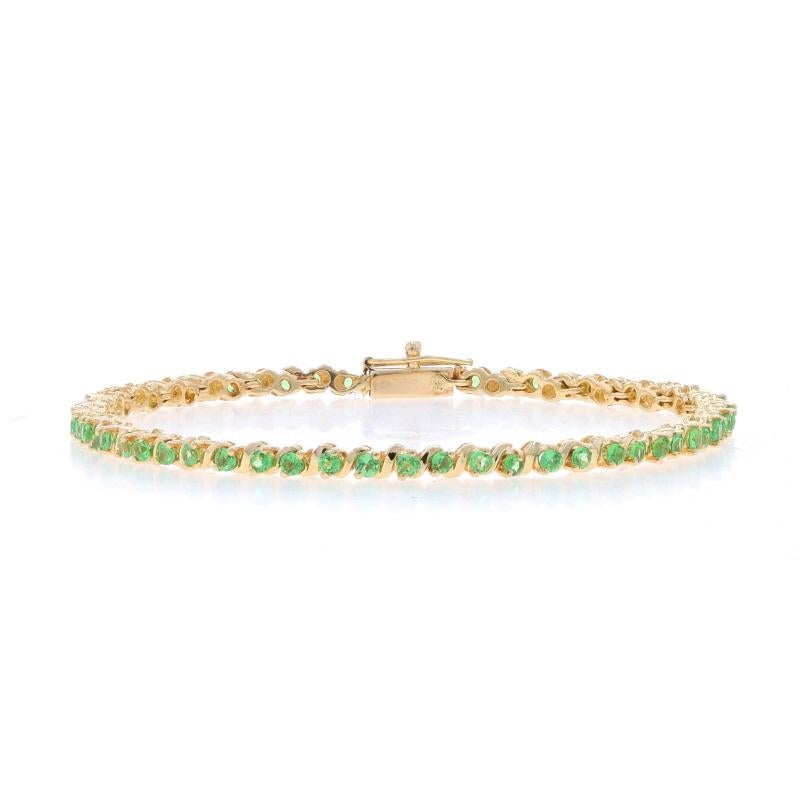 Metal Content: 14k Yellow Gold

Stone Information
Natural Tsavorite Garnets
Carat(s): 2.90ctw
Cut: Round
Color: Green

Total Carats: 2.90ctw

Style: Tennis
Fastening Type: Tab Box Clasp with One Side Safety Clasp

Measurements
Length: 7 1/4
