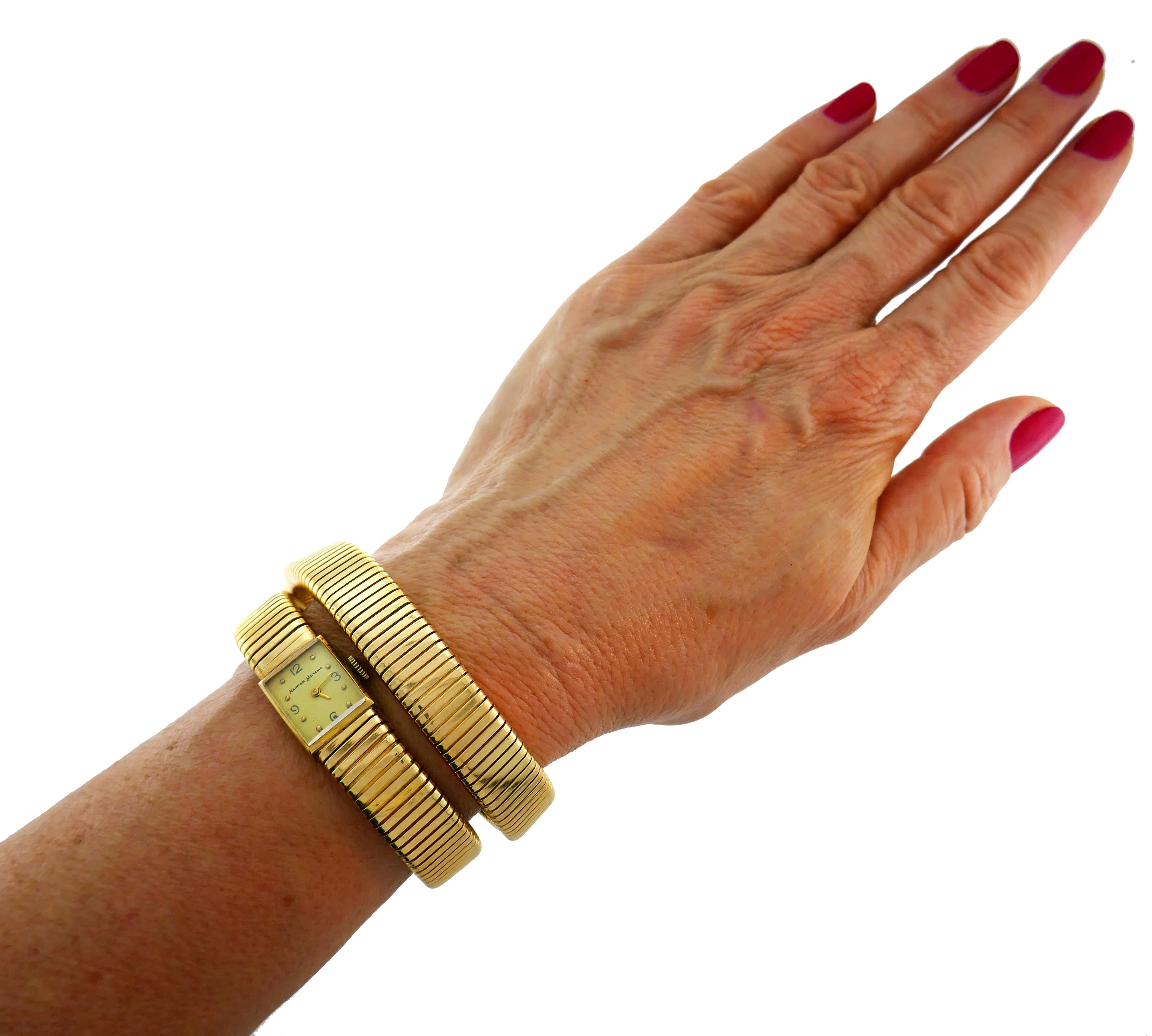 Rare tubogas wrap bracelet watch commissioned by Neiman Marcus with a Swiss watch company Blancpain. Trendy, timeless and wearable, the watch is a great addition to your jewelry collection. 
Made of 14 karat (stamped) yellow gold. The watch movement