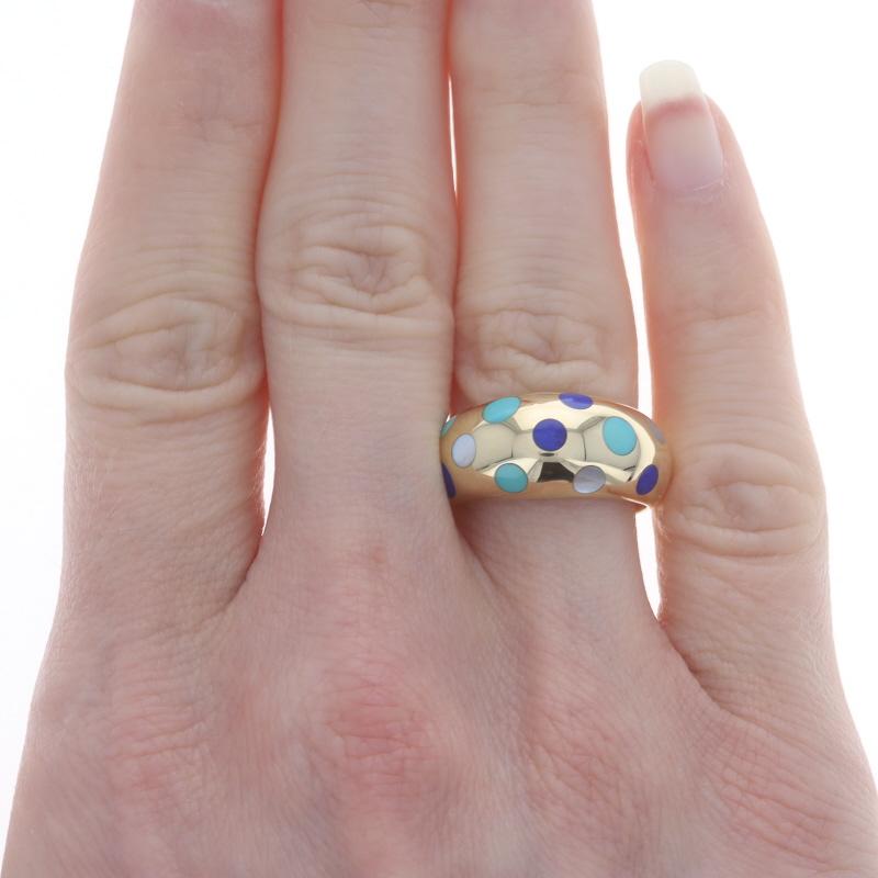 Size: 7

Metal Content: 18k Yellow Gold

Stone Information
Natural Turquoise
Treatment: Routinely Enhanced
Cut: Inlay
Color: Bluish Green

Natural Lapis Lazuli
Cut: Inlay
Color: Blue

Natural Mother of Pearl
Cut: Inlay
Color: White

Style: Dome