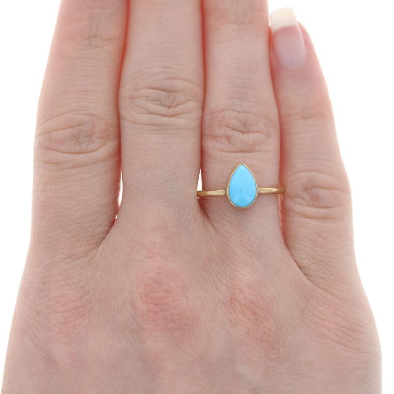 Size: 7
Sizing Fee: Up 1 size for $40 or Down 1 size for $40

Metal Content: 18k Yellow Gold

Stone Information

Natural Turquoise
Treatment: Routinely Enhanced
Cut: Pear Cabochon
Color: Blue

Style: Solitaire
Features: Brushed