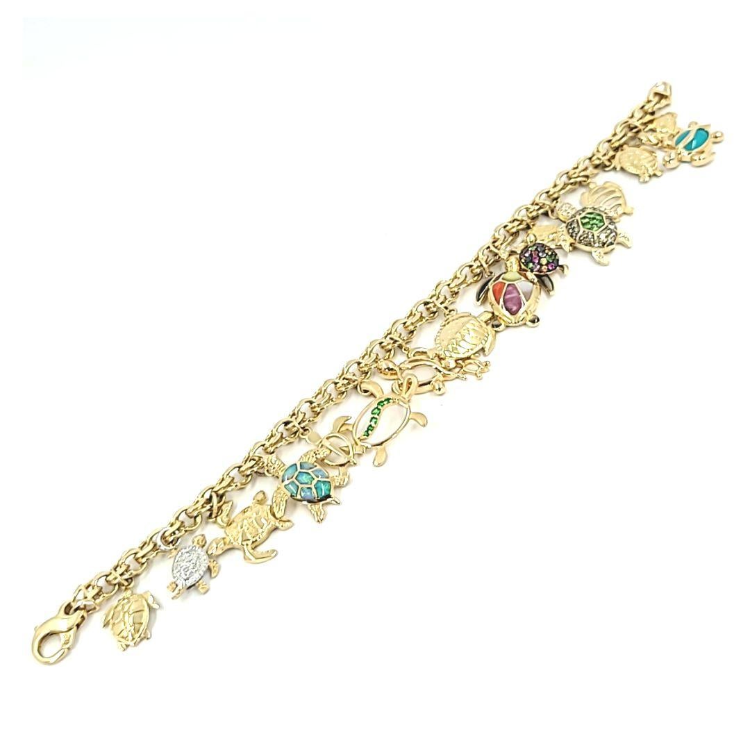 14 Karat Yellow Gold Charm Bracelet Featuring 16 Turtle Charms with Various Gemstones and Inlays Incluing Diamonds, Sapphires, Mother of Pearl and Emeralds. Bracelet is 8 Inches Long with Large Lobster Clasp, and Can Be Shortened Upon Request.
