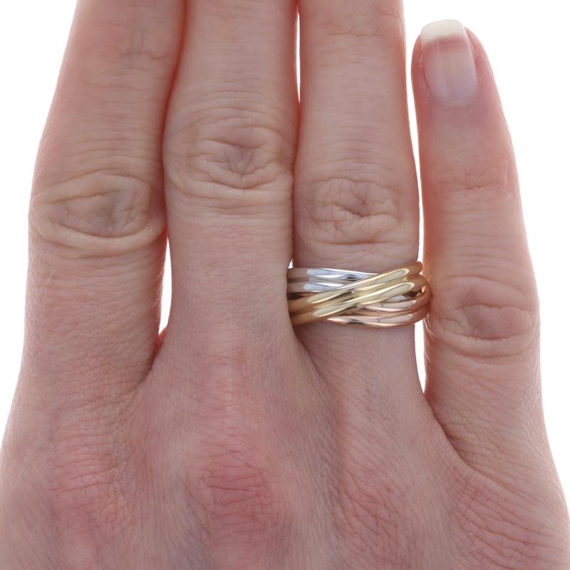 Size: 6

Metal Content: 14k Yellow Gold, 14k White Gold, & 14k Rose Gold

Style: Statement Band
Features: Ribbed twist design spanning the entire perimeter

Measurements

Face Height (north to south): 11/32