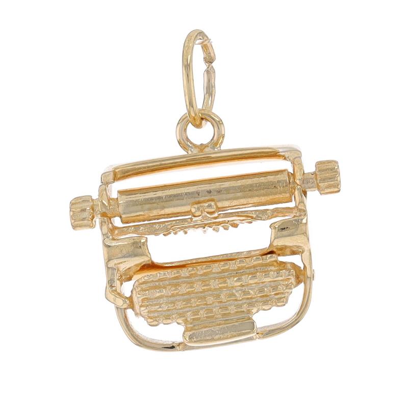 Metal Content: 14k Yellow Gold

Theme: Typewriter, Writing Tool, Author Journalist Office Assistant Secretary
Features: The platen and platen knobs rotate, and a spring under the keyboard allows it to move up and down.

Measurements

Tall (from