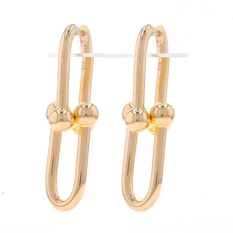 Metallgehalt: 18k Gelbgold

Stil: U-Link Hoop Drop
Verschlusstyp: Schnappverschlüsse
Thema: Büroklammer-Ball

Messungen
Hoch: 1 25/32