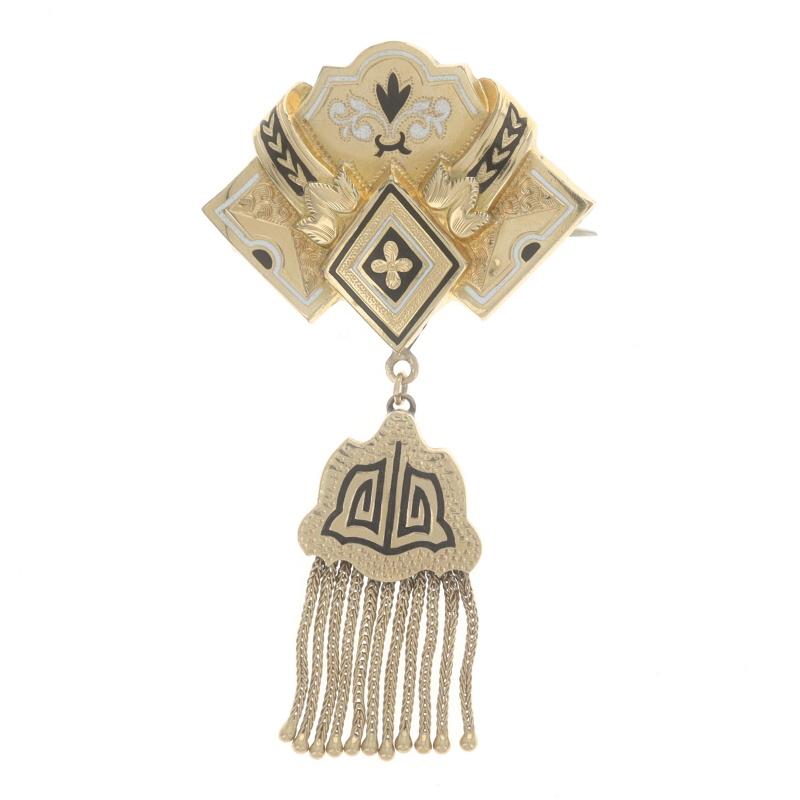 Era: Victorian
Date: 1870s - 1880s

Metal Content: 14k Yellow Gold (brooch) & Gold Filled (backing)

Material Information
Enamel
Color: Black & White

Style: Tassel Dangle Brooch
Chain Style: Foxtail
Fastening Type: Hinged Pin and C-Clasp
Theme: