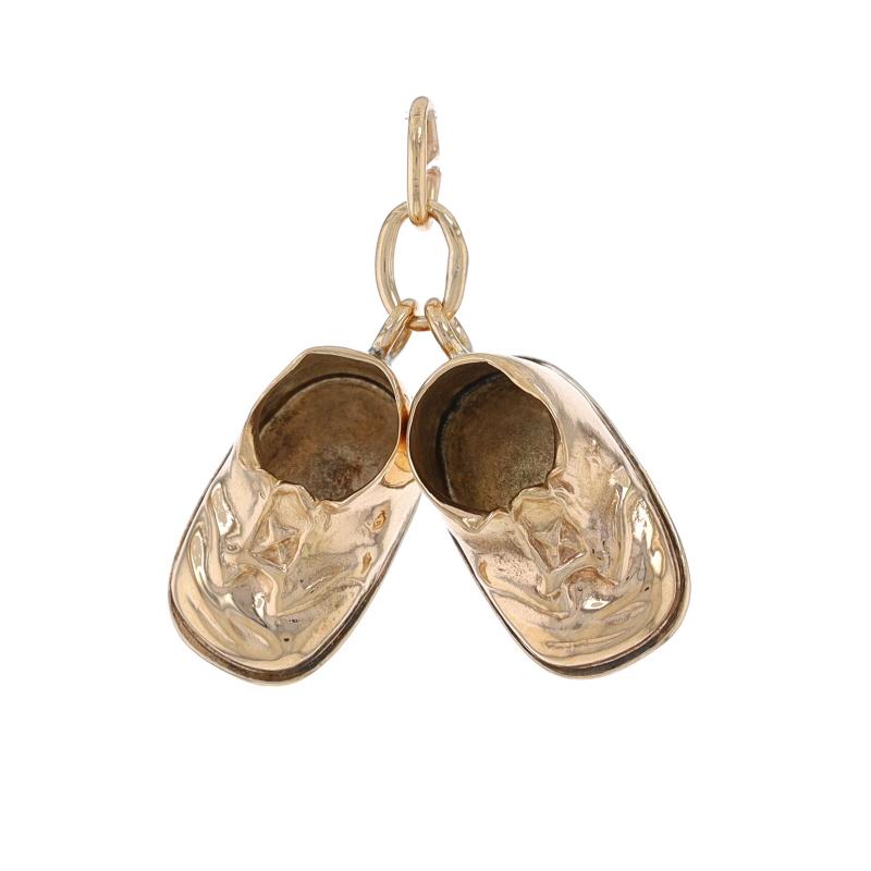 Era: Vintage

Metal Content: 14k Yellow Gold

Theme: Baby Shoes, First Steps, Walkers

Measurements
Tall (from stationary bails): 19/32