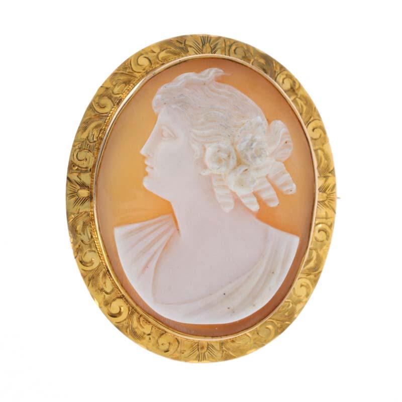 Era: Vintage 

Metal Content: 14k Yellow Gold

Stone Information:
Carved Shell 

Measurements: 1 21/32
