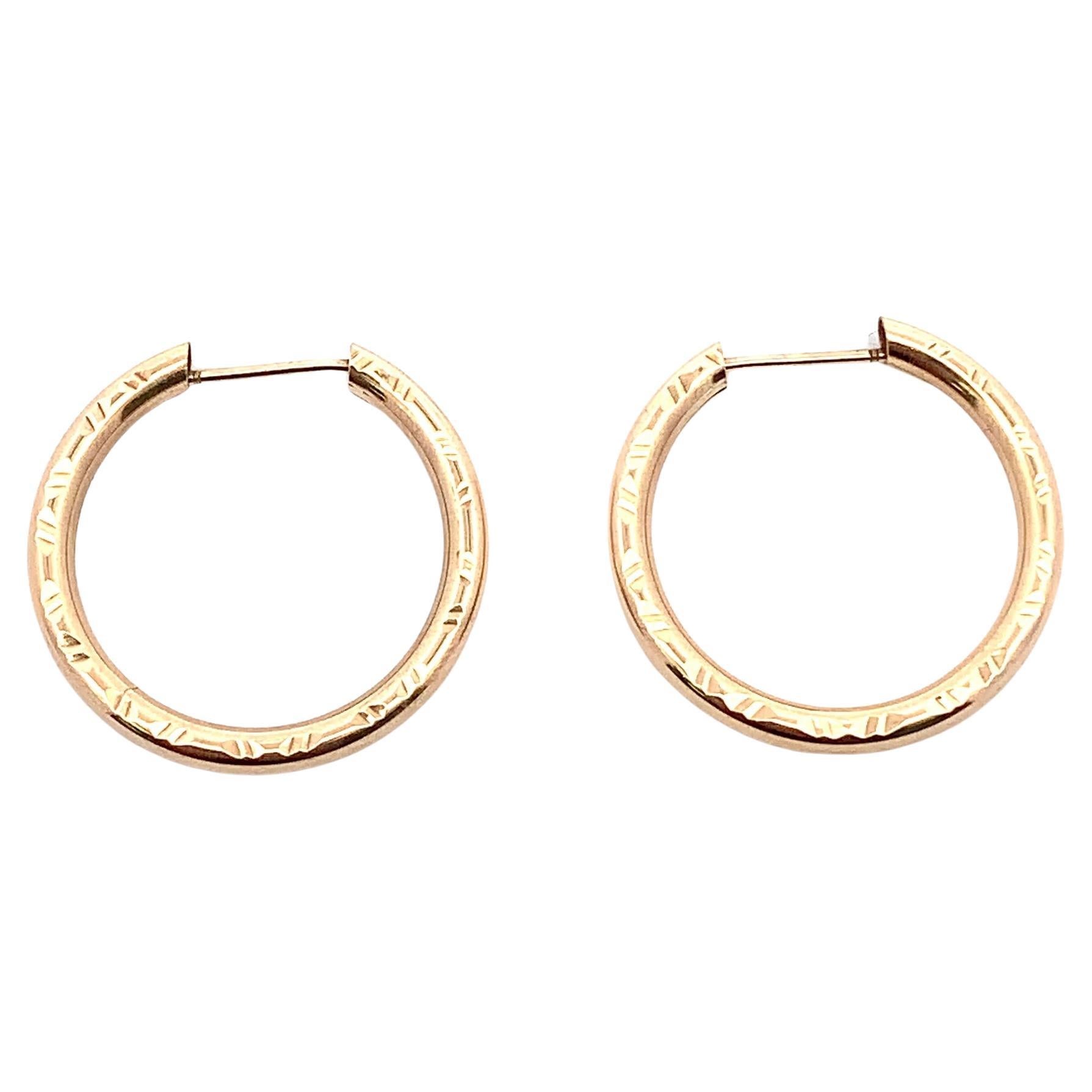 Pendientes huggie vintage de aro en oro amarillo en venta