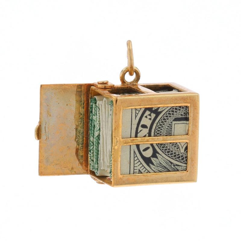 Era: Vintage

Metal Content: 14k Yellow Gold

Theme: Mad Money, Emergency Folded $1 Bill
Features: Lid Opens

Measurements

Tall (from stationary bail): 21/32