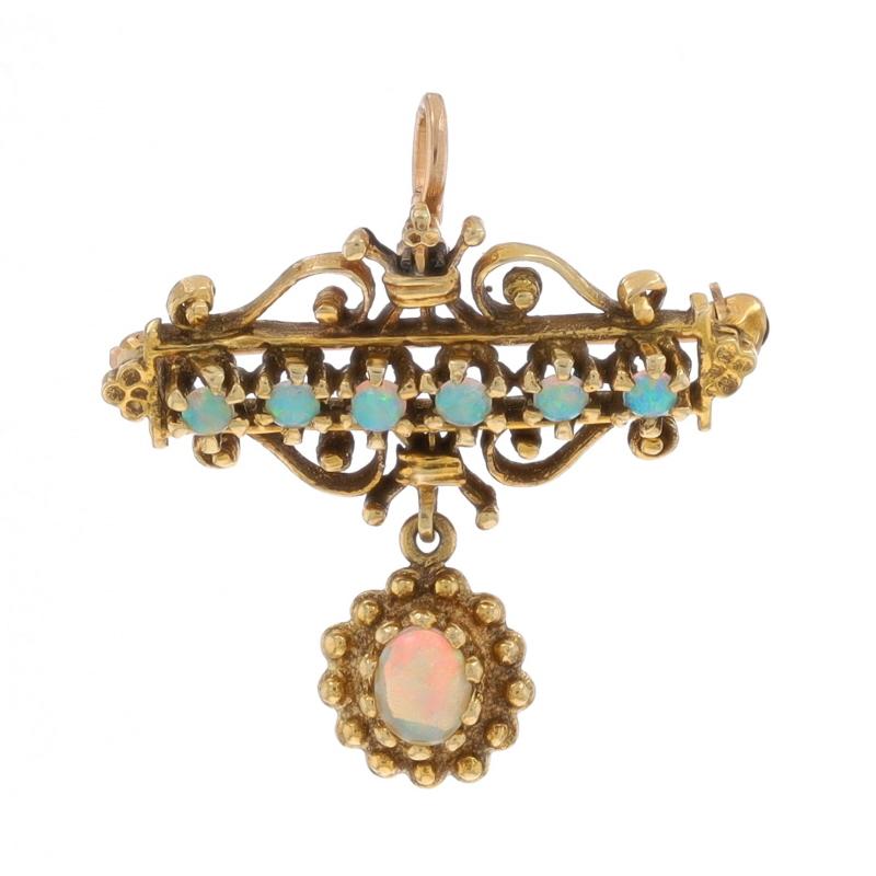 Era: Vintage 

Metal Content: 14k Yellow Gold

Stone Information
Natural Opals
Carat(s): .50ctw
Cut: Oval Cabochon & Round Cabochon

Total Carats: .50ctw

Style: Convertible Brooch/Pendant
Fastening Type: HInged Pin and Whale Tail Bullet