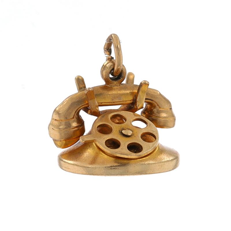 Era: Vintage

Metal Content: 10k Yellow Gold

Theme: Rotary Telephone, Love Messages
Features: The finger wheel moves to reveal the message 