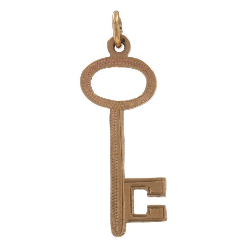 Era: Vintage

Metal Content: 9k Yellow Gold

Theme: Skeleton Key
Features: Etched Detailing

Measurements

Tall (from stationary bail): 1 1/32