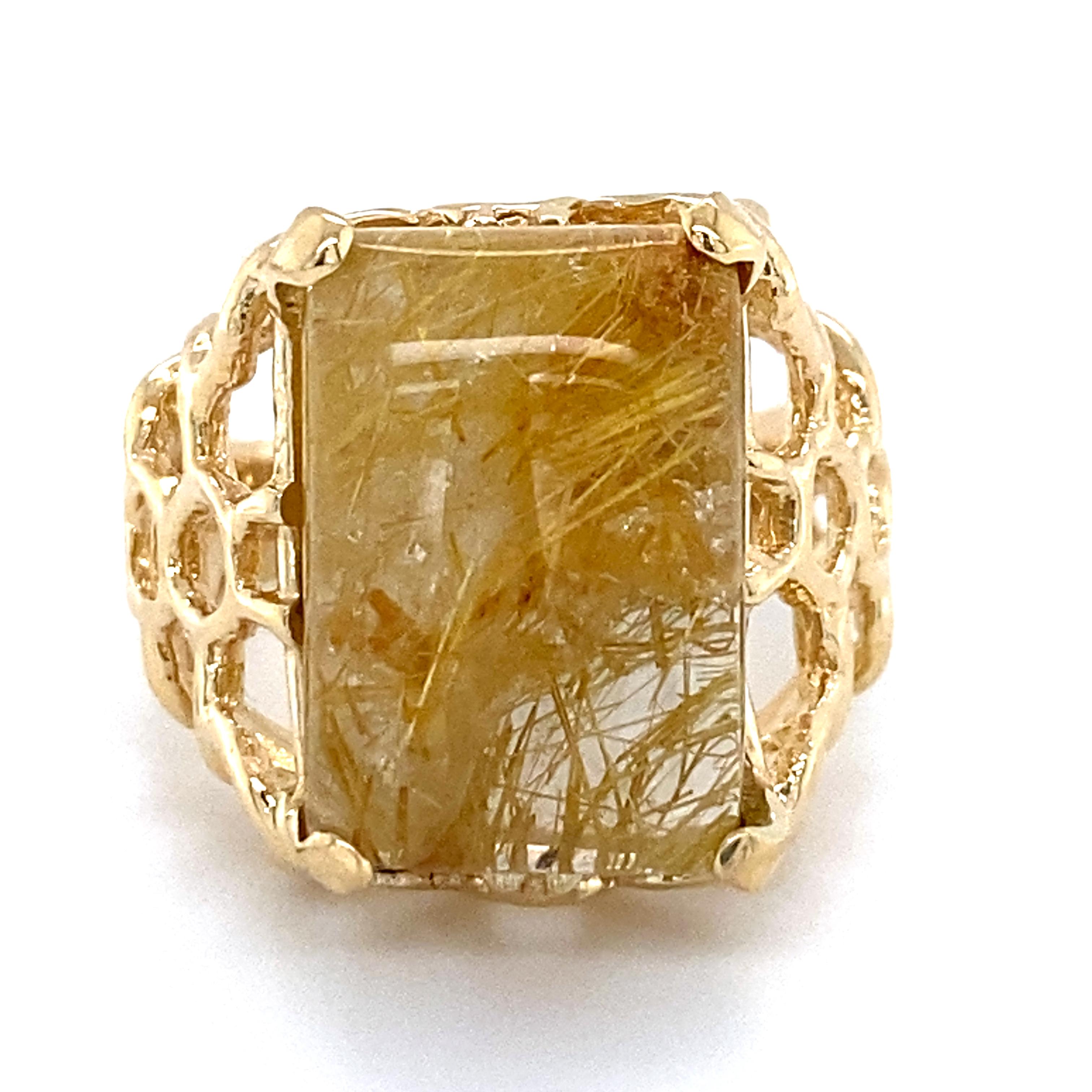 This unusual ring, probably made in the 1980s or 1990s, features wide shoulders and an elevated platform  with an openwork pattern resembling scales or webbing.  

When it landed in our lap, it was set with a gacky lemon quartz.  We've got no