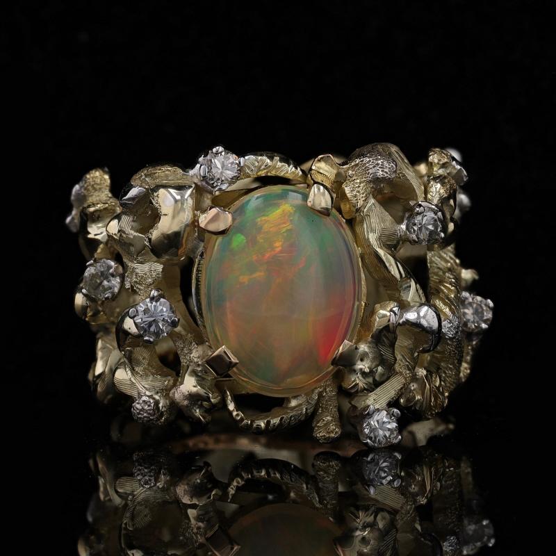 Size: 6

Metal Content: 14k Yellow Gold & 14k White Gold

Stone Information

Natural Welo Opal
Carat(s): 3.30ct
Cut: Oval Cabochon
Size: 12.3mm X 9.3mm

Natural Diamonds
Carat(s): .30ctw
Cut: Round Brilliant
Color: I - J
Clarity: SI2 - I1

Total