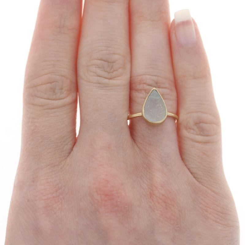 Size: 7
Sizing Fee: Up 2 sizes for $40 or Down 2 sizes for $40

Metal Content: 18k Yellow Gold

Stone Information

Natural White Druzy
Cut: Pear

Style: Solitaire
Features: Textured Finishes

Measurements

Face Height (north to south): 17/32