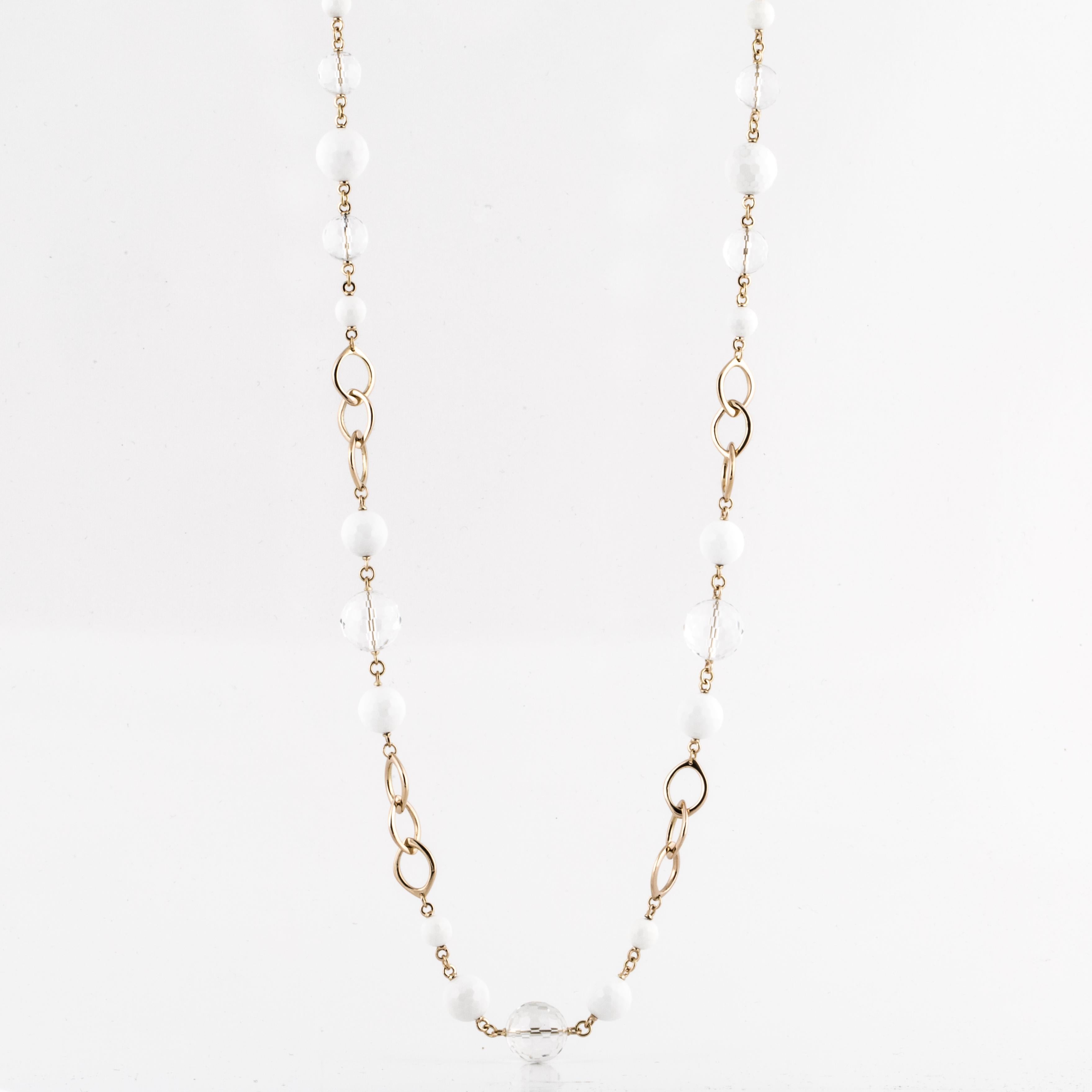 18K yellow gold necklace with faceted white onyx and rock crystal beads.  The piece measures 40