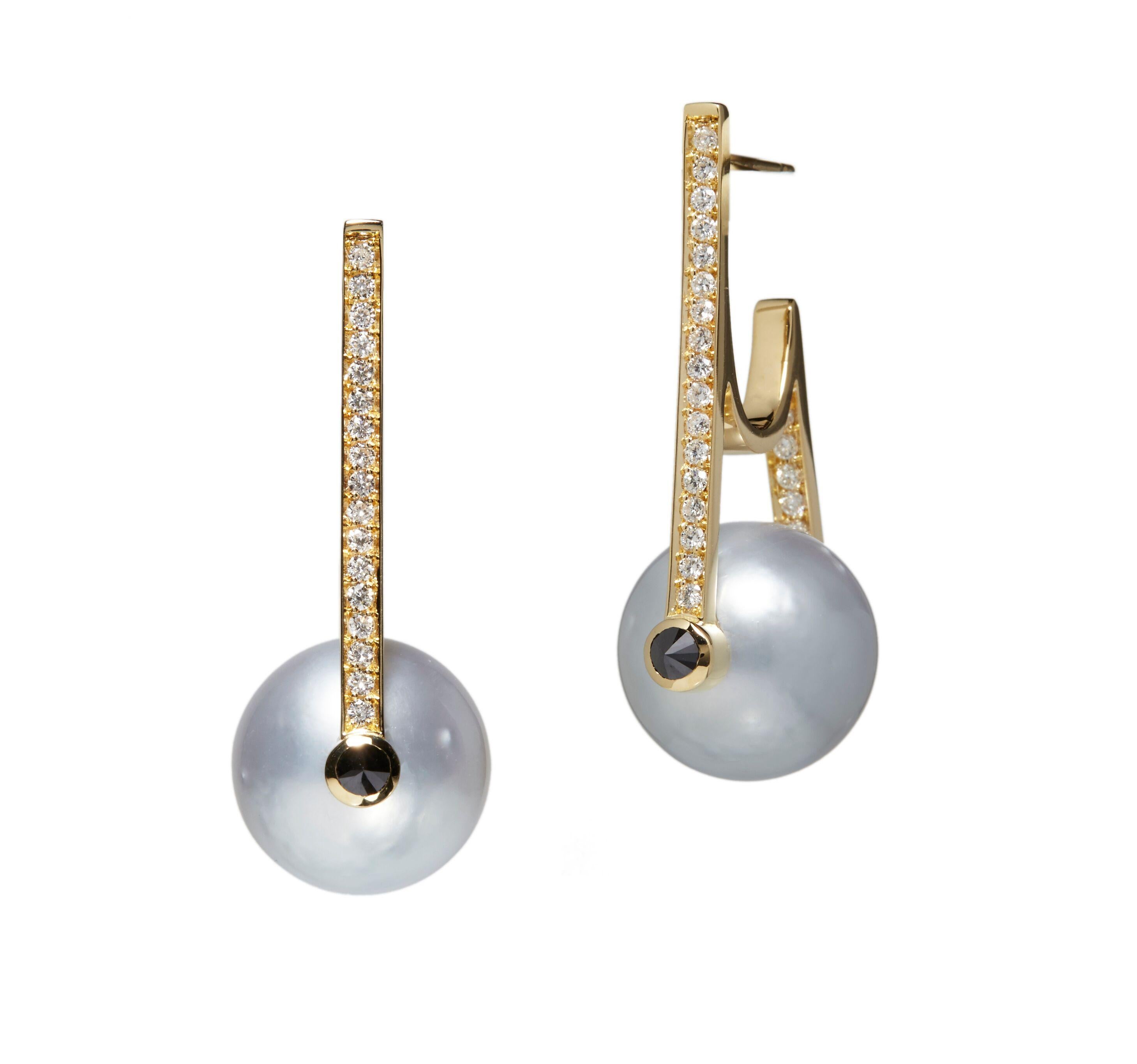 Ara Vartanian White Pearl Earrings, reference EA210-7. Composed of two White pearls in a round shape, along with four Black Diamonds and forty-eight White Diamonds.  This piece offers a unique, contemporary yet Elegant Piece of jewellery. 
If you