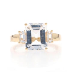 Yellow Gold White Topaz Three-Stone Ring - 10k Emerald Cut 5.18ctw