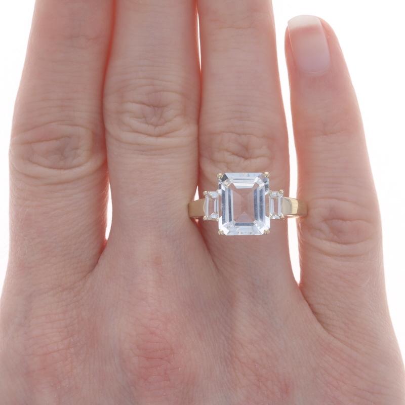Yellow Gold White Topaz Three-Stone Ring - 10k Emerald Cut 5.18ctw In Excellent Condition For Sale In Greensboro, NC