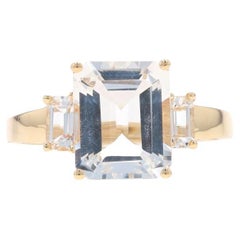 Yellow Gold White Topaz Three-Stone Ring - 10k Emerald Cut 5.18ctw