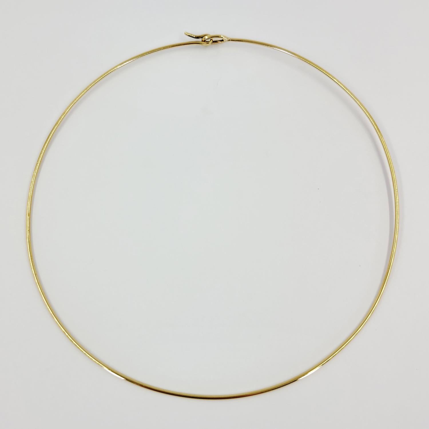 14 Karat Yellow Gold Round Wire Choker Necklace Measuring 1.5mm Wide and 15 Inches Long. Finished Weight Is 6.7 Grams.