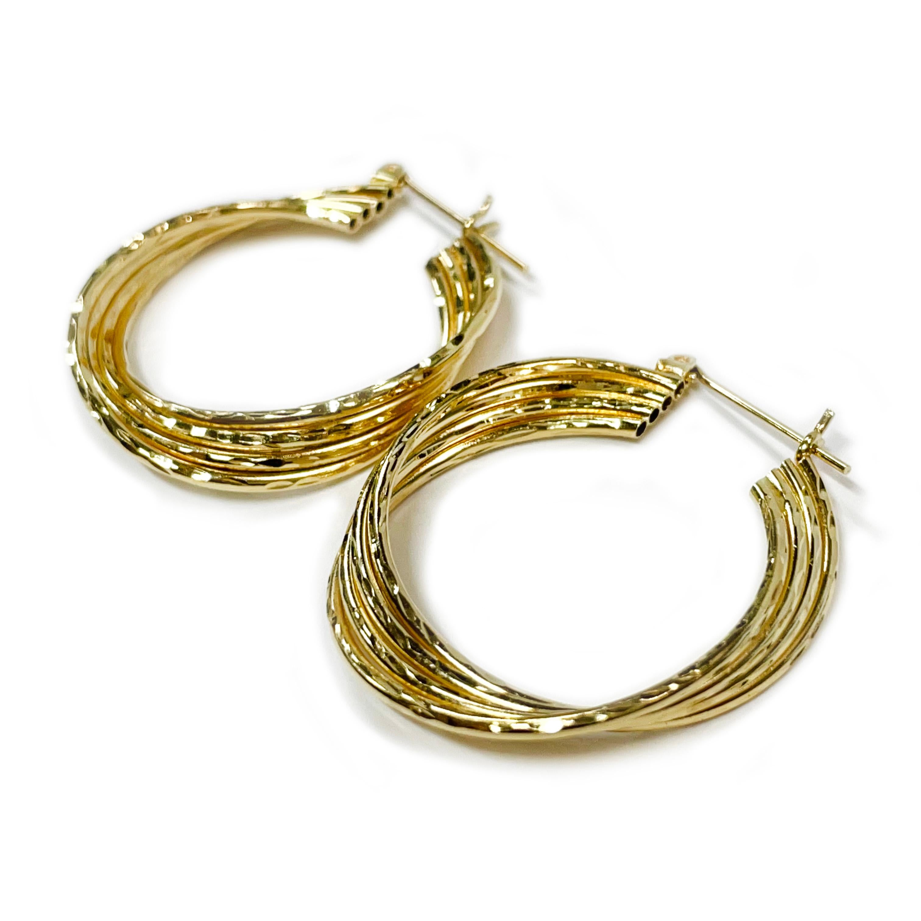 14 Karat Yellow Gold Wire Diamond Cut Hoop Earrings. These lovely hollow lightweight hoops are made up of four wire hoops joined together, each wire has diamond-cut detail and the earrings has a joint and catch closure. Perfect for daily use or