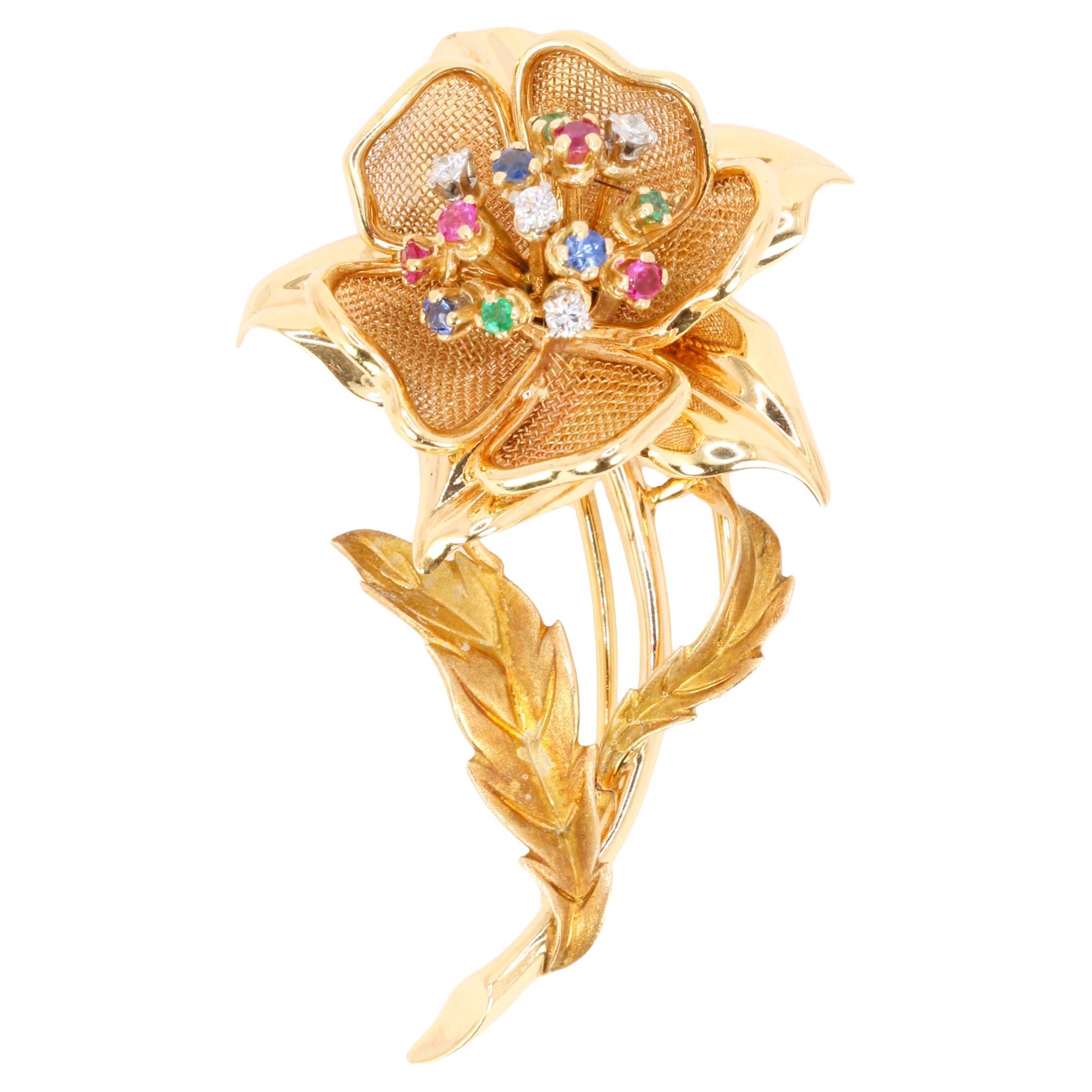 Broche fleur en or jaune avec diamants, rubis, émeraudes et saphirs