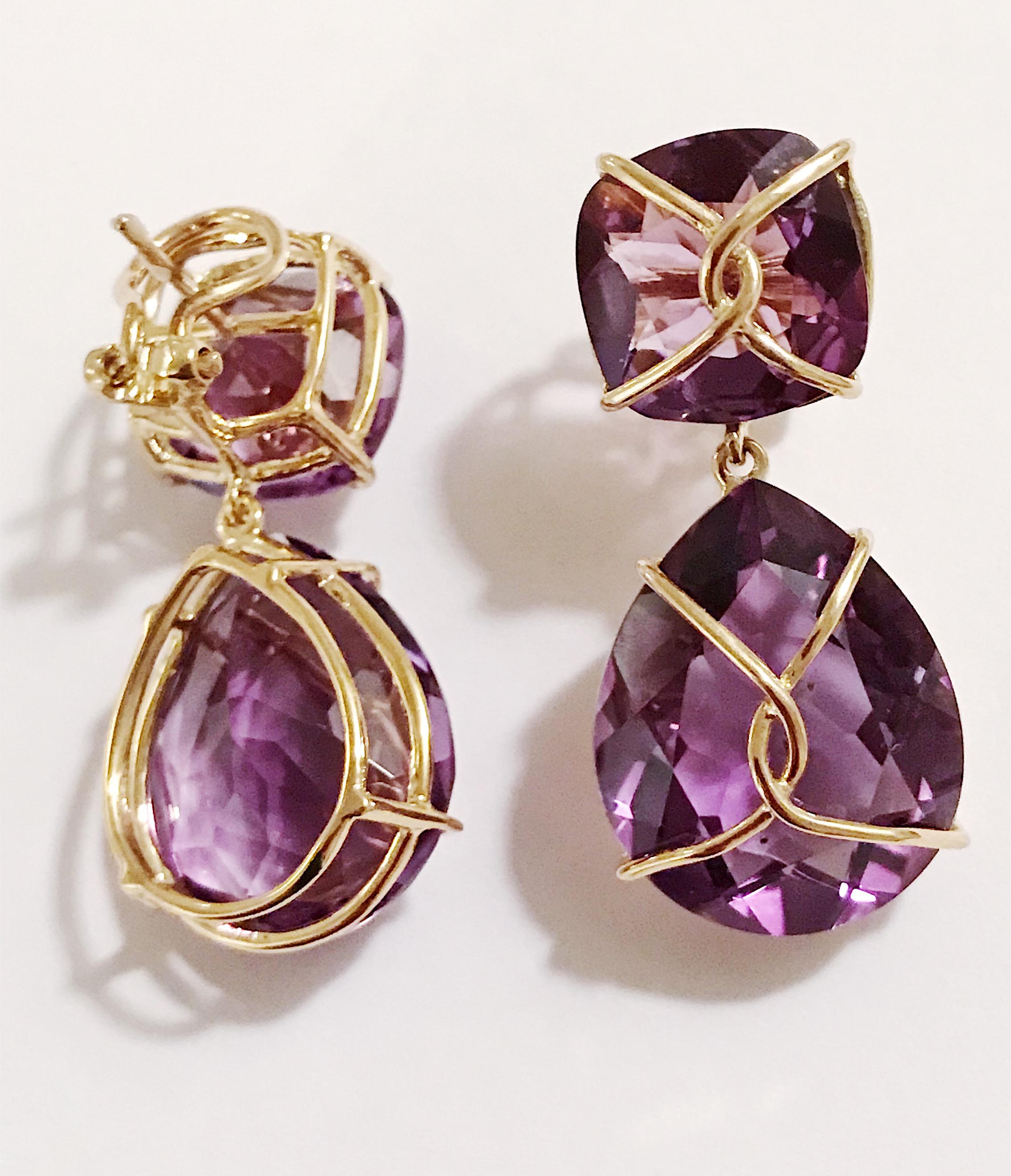 18kt Yellow Gold Drop Earring with gold wrapped faceted cushion shaped Purple Amethyst top and faceted pear-shaped Purple Amethyst.

This elegant earring measures an inch and a half long. The top cushion is shaped Amethyst that measures half an inch