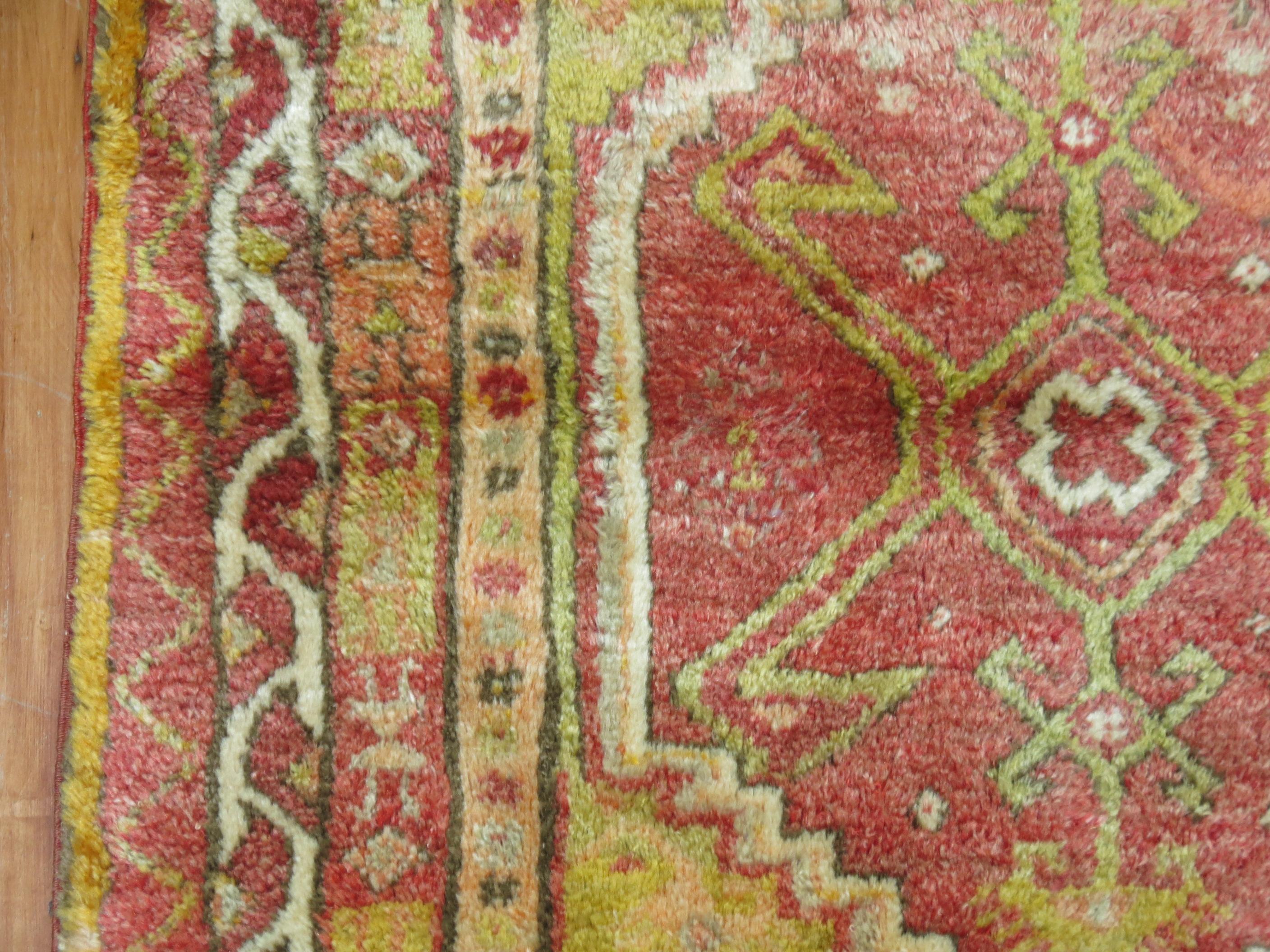 Mid 20th century full pile Turkish Anatolian Tribal rug in soft red, yellow and green,

circa 1940. Measures: 3'3'' x 4'8''.