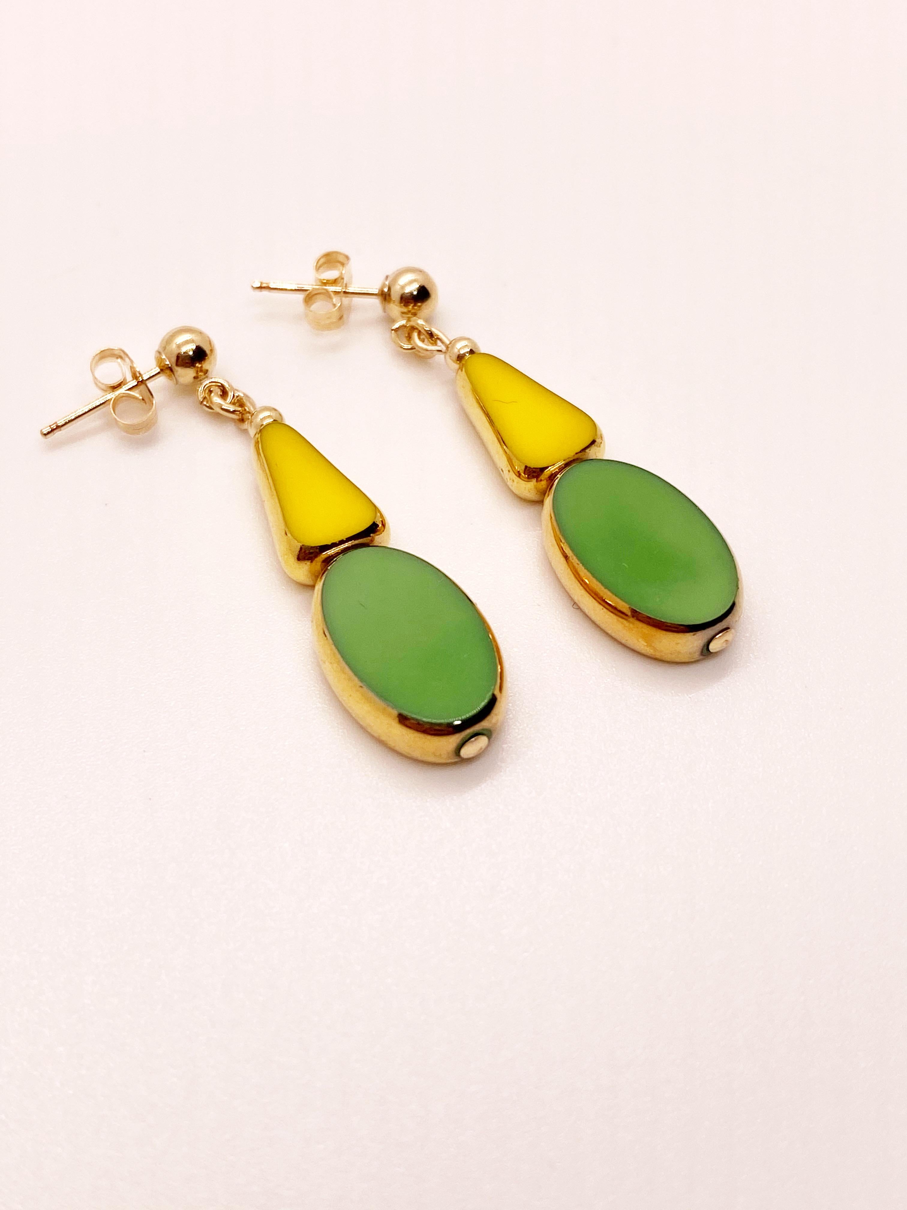 Bright and bold, yellow and green colored German vintage glass beads edged with 24K gold dangles on a 4mm ball 14K gold filled earring post. 

The German vintage glass beads are considered rare and collectible, circa 1920s-1960s.

*Our jewelry have